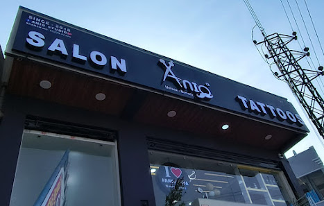 Exterior front entrance and logo signboard of ANIQ Salon Annojiguda